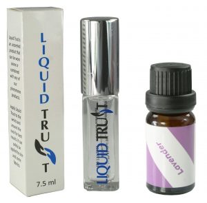 Liquid Trust, in a square glass bottle with a shiny silver cap, and Lavender essential oil, in a brown screw-cap bottle with a purple label, sit next to each other against a white background.